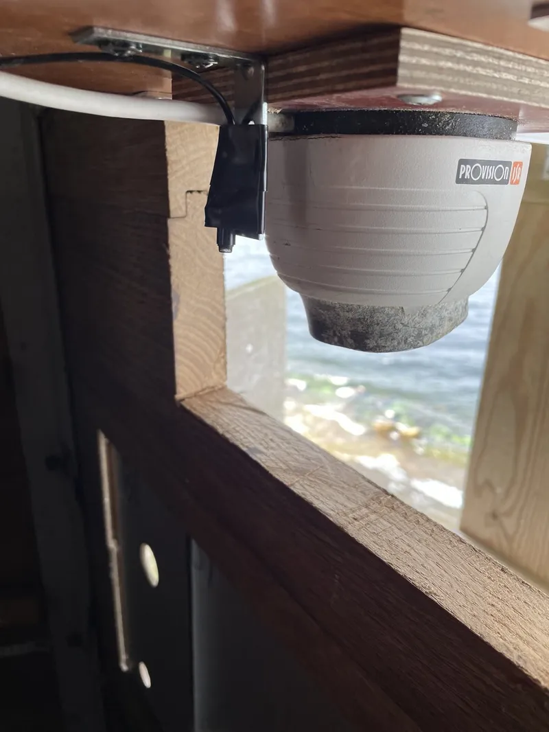 Close-up of a DPA microphone next to an IP camera